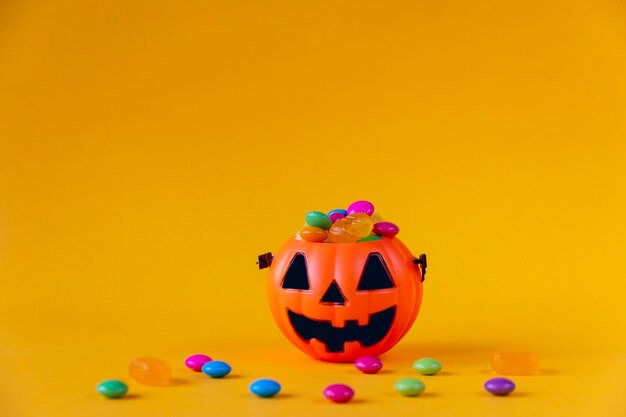 Close-up of multi colored ball against yellow background