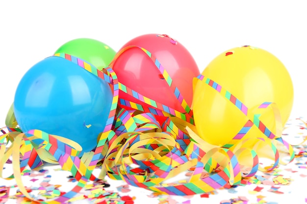 Close-up of multi colored balloons and decoration against white background