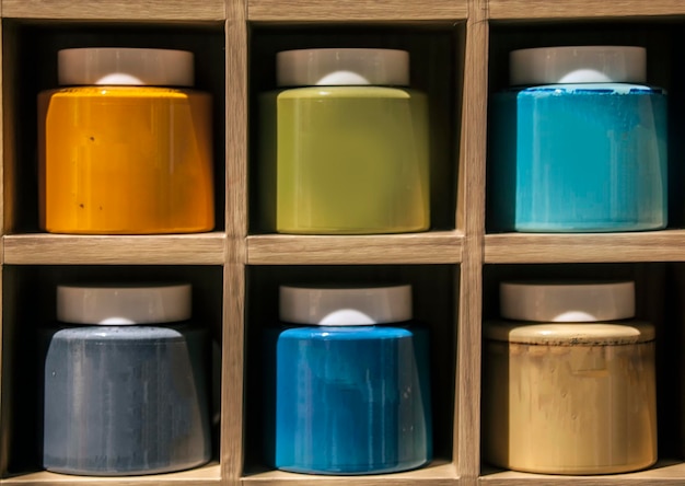 Photo close-up of multi colored bottle in shelf