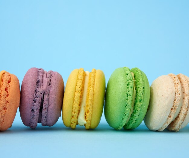 Close-up of multi colored candies against blue background