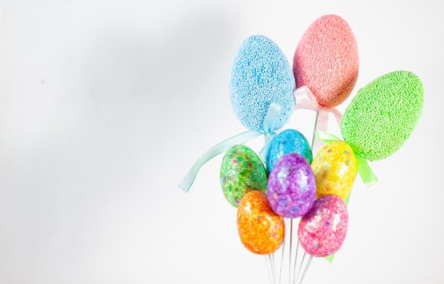 Photo close-up of multi colored candies against white background