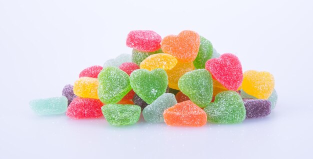 Close-up of multi colored candies against white background