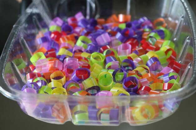 Photo close-up of multi colored candies in glass