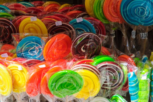 Close-up of multi colored candies for sale at candy store