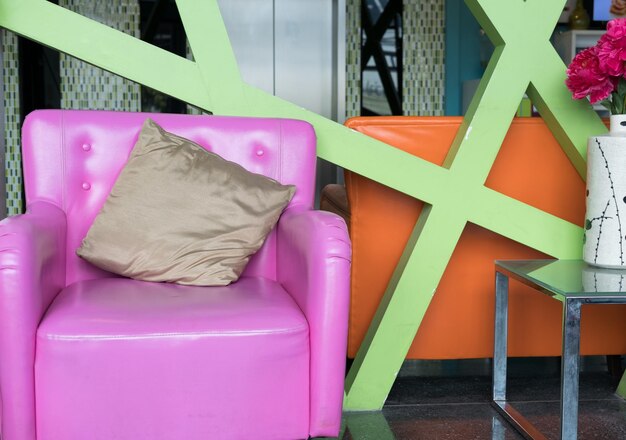 Photo close-up of multi colored chairs on table