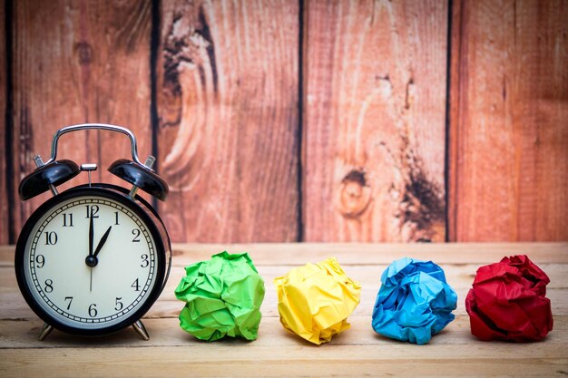 Close-up of multi colored clock on wood