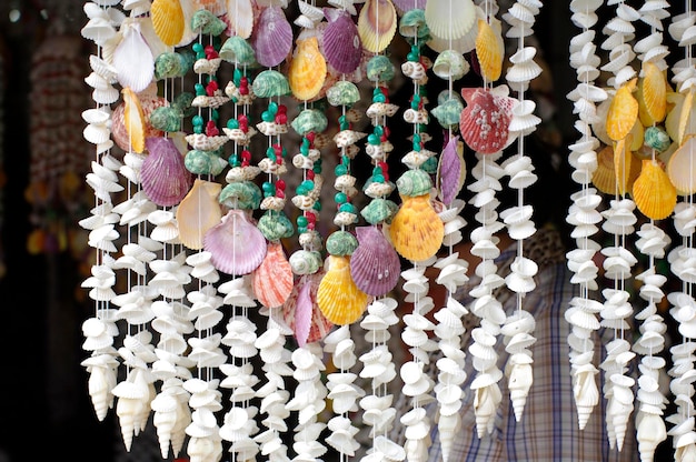 Photo close-up of multi colored decorations hanging in store for sale