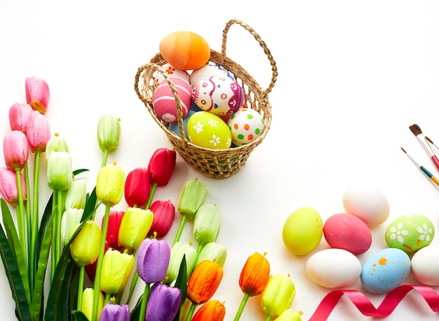 Close-up of multi colored easter eggs against white background