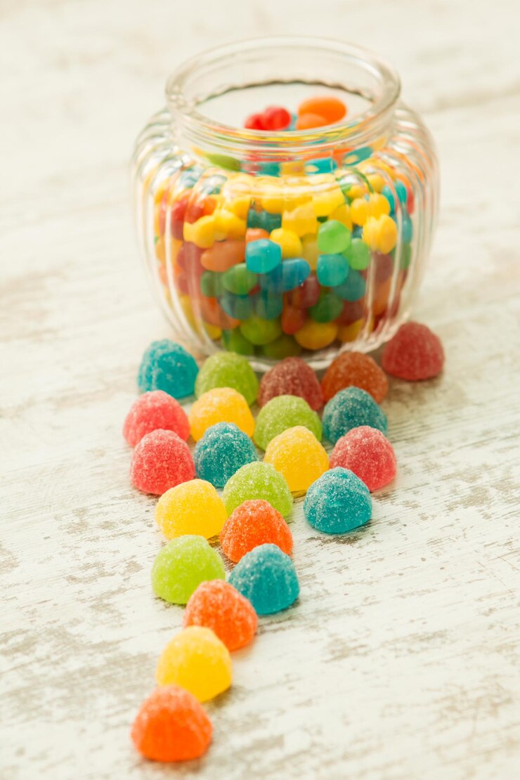 Photo close-up of multi colored glass jar on table