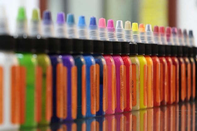 Close-up of multi colored ink bottles