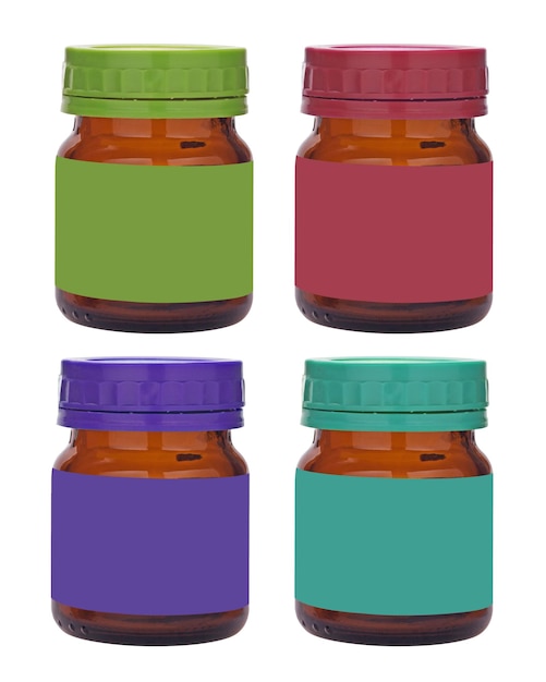 close-up of multi colored jars against white background