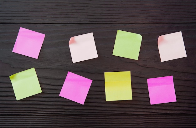 Close-up of multi colored notes on table