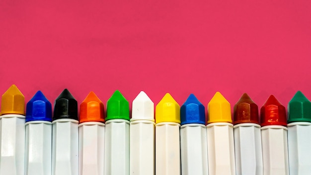 Close-up of multi colored pencils against white background