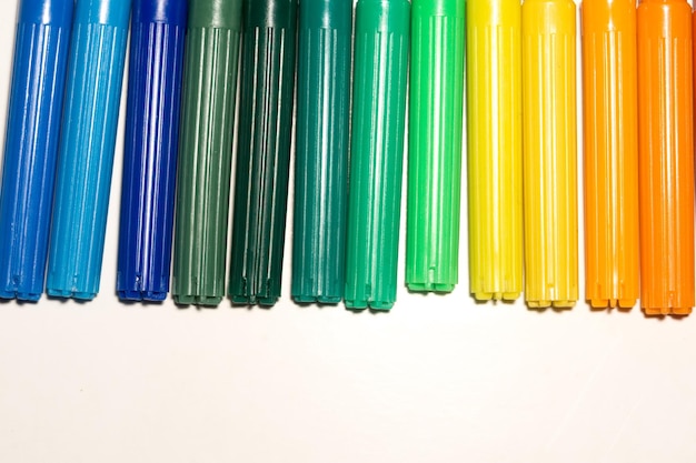 Photo close-up of multi colored pencils against white background