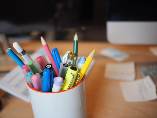 Close-up of multi colored pencils on table