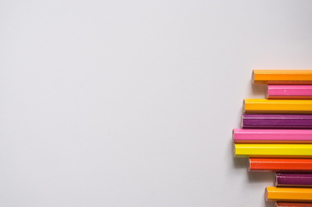 Close-up of multi colored pencils on table