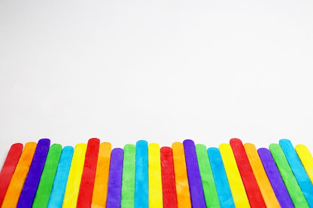 Close-up of multi colored pencils over white background