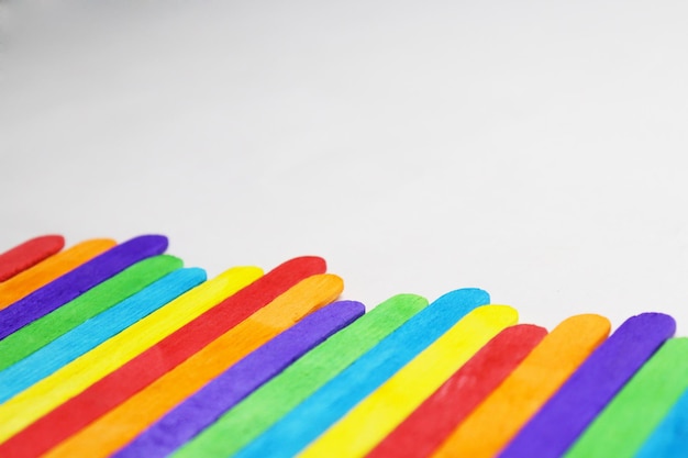 Close-up of multi colored pencils over white background
