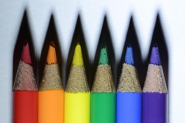 Photo close-up of multi colored pencils on white table