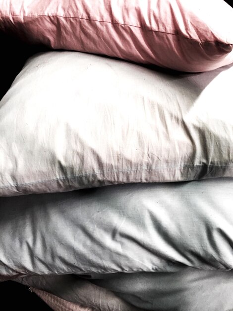 Photo close-up of multi colored pillow stack