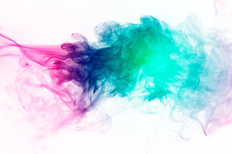 Photo close-up of multi colored smoke against white background
