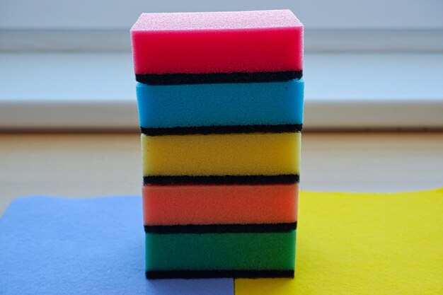 Close-up of multi colored sponges on table