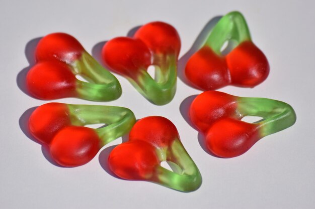 Close-up of multi colored tomatoes over white background