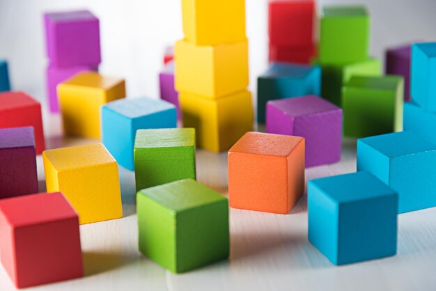 Photo close-up of multi colored toy blocks on table