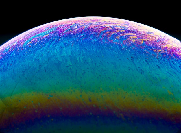 close-up of multi colored water against black background