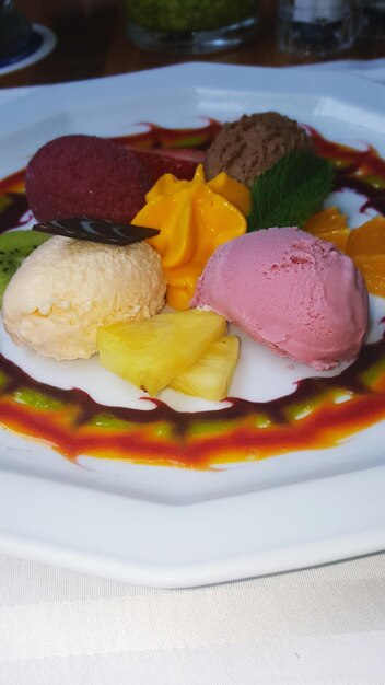 Photo close-up of multi various flavored ice creams on plate