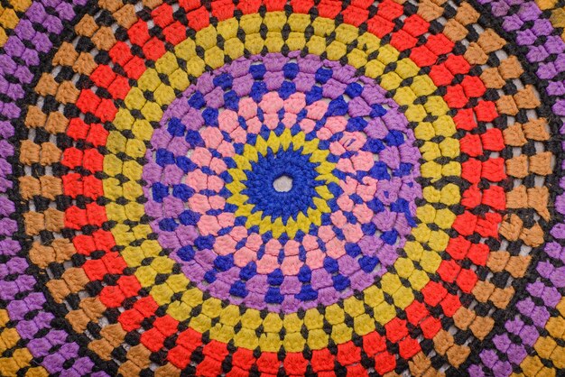 Close up of a multicolored crocheted carpet