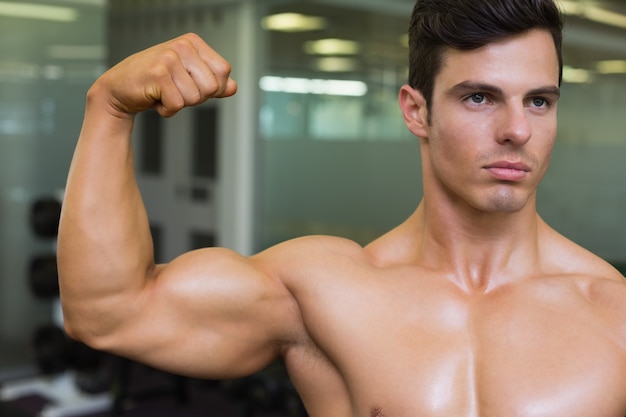 Close-up of muscular man flexing muscles