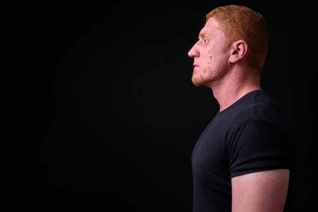 Close up of muscular man from Syria with orange hair isolated