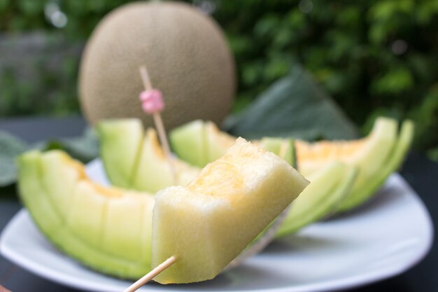 Close-up of muskmelons in plate