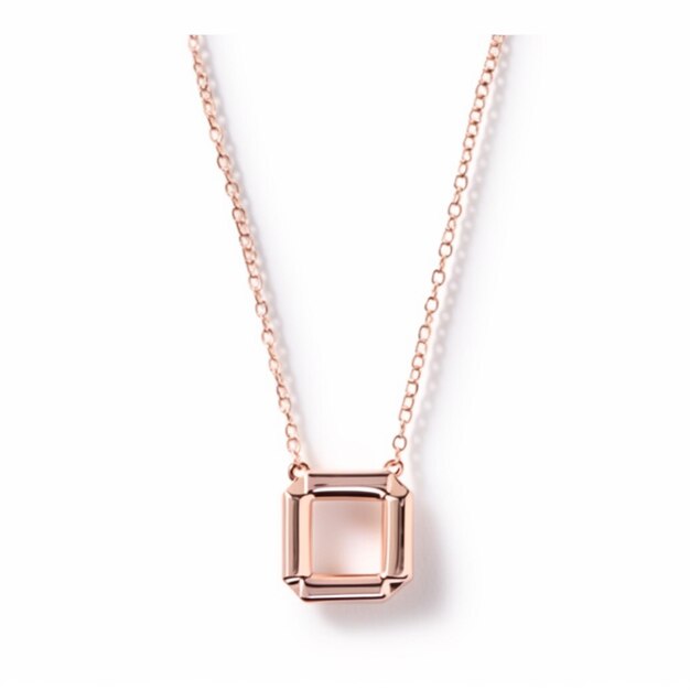 a close up of a necklace with a square shaped pendant on a chain generative ai