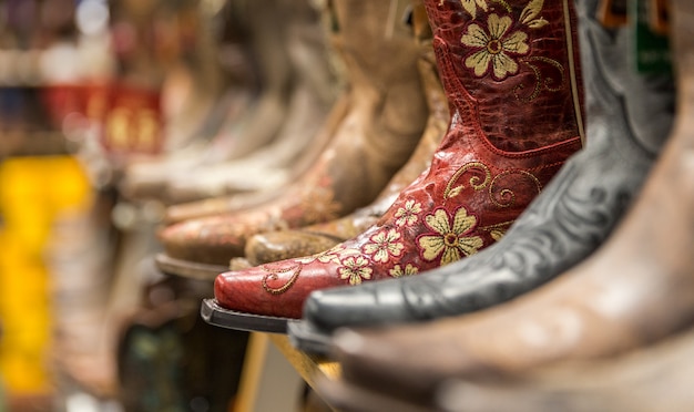 Close-up of new cowboy boots on shelf