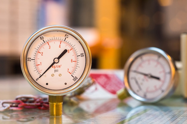 Close-up of new set of pressure gauge on glass table preparation maintenance