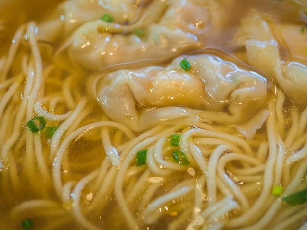 Close up noodle soup with shrimp and pork wantons