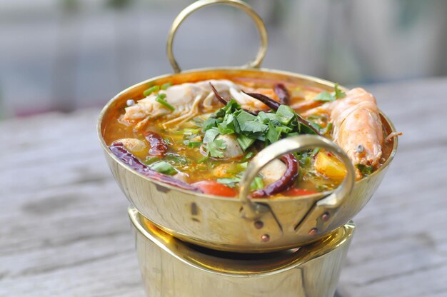 Close-up of noodles in glass on table