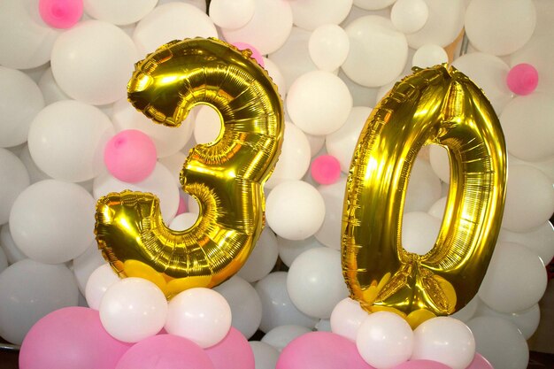 Close-up of number 30 on balloons