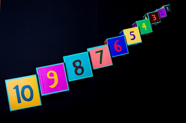Close-up of number blocks on black background
