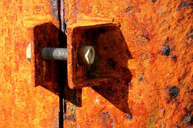 Close-up of nut and bolt on rusty metal