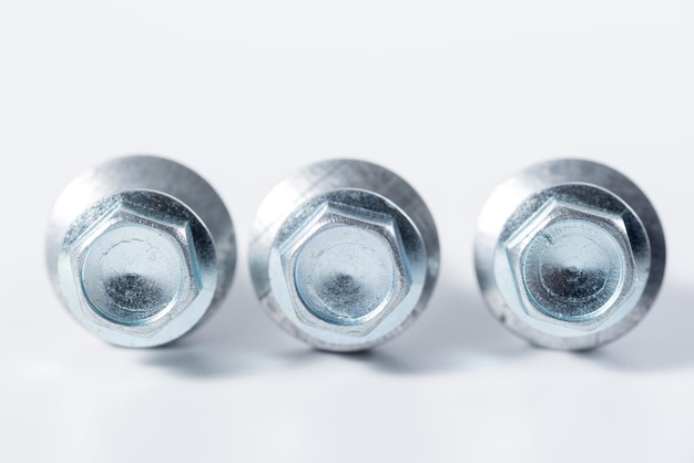 Photo close-up of nut bolt on white background