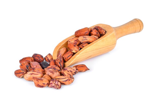 Close-up of nuts in wooden scoop