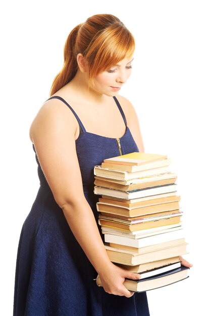 Фото Клоуз-ап молодой женщины с книгами на белом фоне