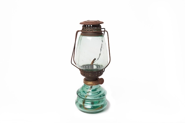 Close-up of oil lamp against white background