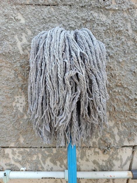 Close up of old brush mop