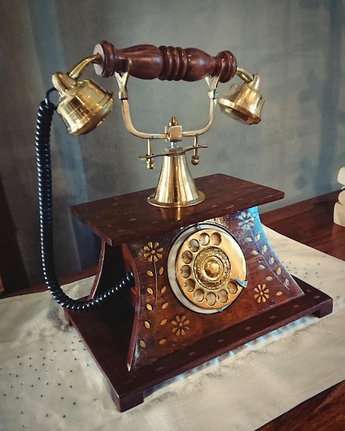 Close-up of old-fashioned telephone on table