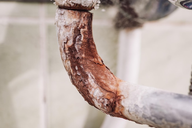 Close up of old faucet in rust Concept of unsanitary conditions bad quality of water toned photo