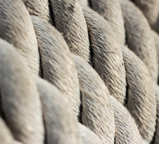 Close-up of old frayed boat rope as a background in war ship